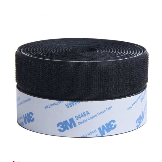 Black hook and loop tape roll with coated liner on the spool