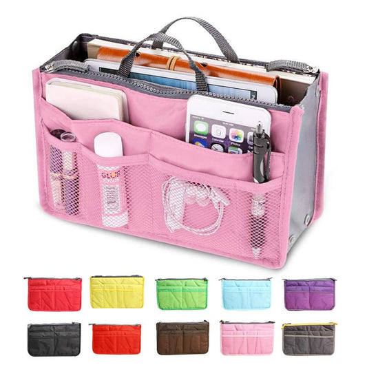 Pink toiletry organizer insert with mesh pockets and zippered compartments