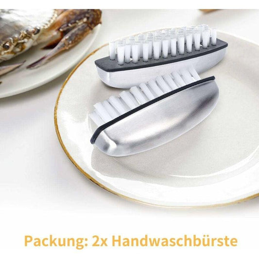 Set of two nail cleaning brushes with white bristles and silver cases