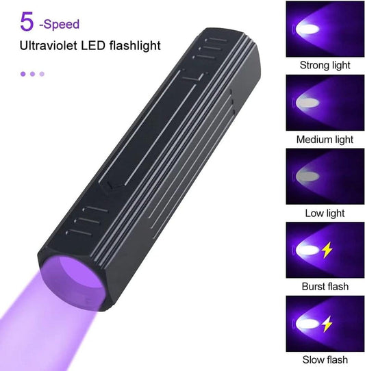 Black UV flashlight emitting purple glow, multiple light intensity modes
