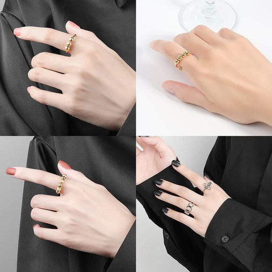 Gold antistress fidget ring with small crystal stones on finger
