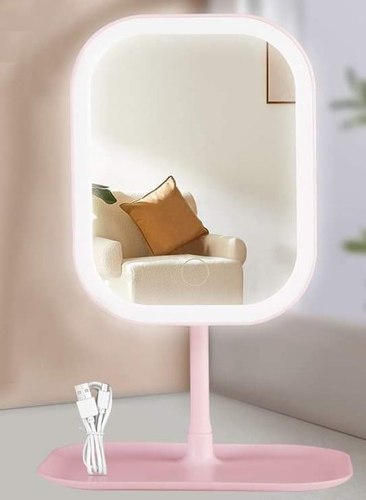 Pink LED makeup mirror with rectangular frame, rounded corners, on stand