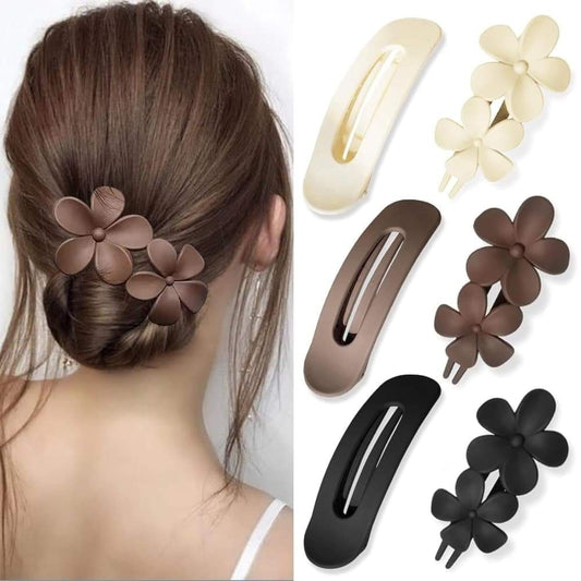 Flower hair clips attached to a hair bun; includes brown, black, and beige clips