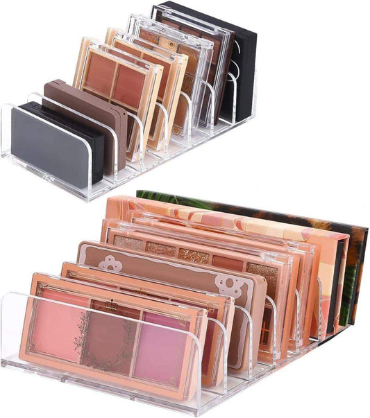Clear acrylic makeup organizer with 7 compartments, pink and tan palettes inside