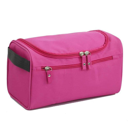 Pink waterproof makeup bag with front zipper pocket and stitched side panels
