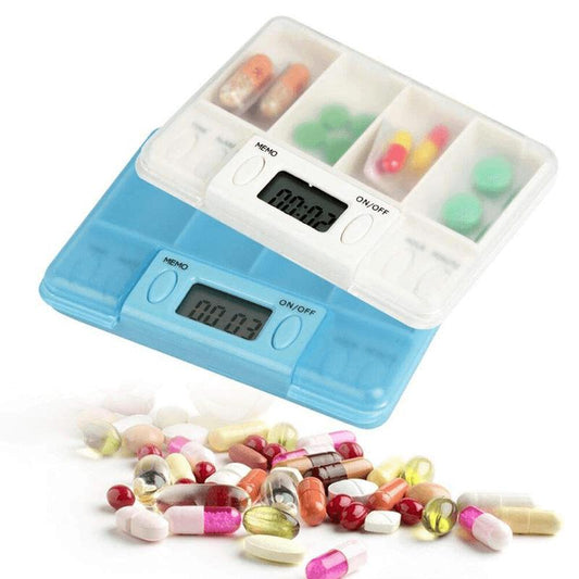 White pill organizer case with four compartments and digital timer display