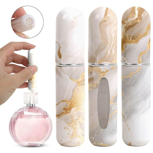 Travel perfume atomizer bottles with champagne-gold marble veining and silver spray caps
