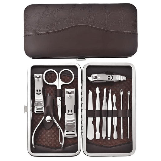 Manicure pedicure grooming set in brown patterned case, clippers, scissors, files and tools
