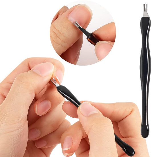 Black cuticle remover and pusher tool with metal fork tip on finger