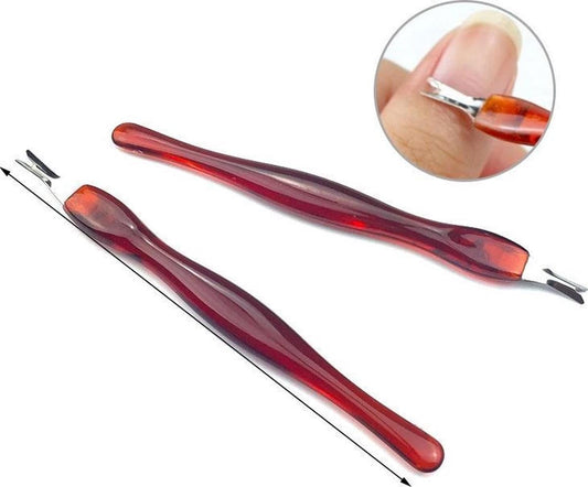 Cuticle knife tool with red translucent handle and metal fork, angled with pointed tip