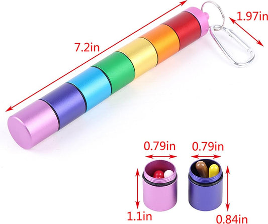 Multicolor pill box tube with keychain loop; compartments show small capsules