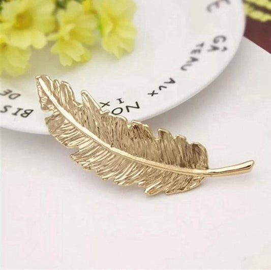 Gold feather hair clip barrette with ridged feather design