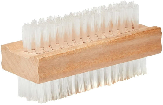 Rectangular wooden nail brush with soft white bristles, angled view