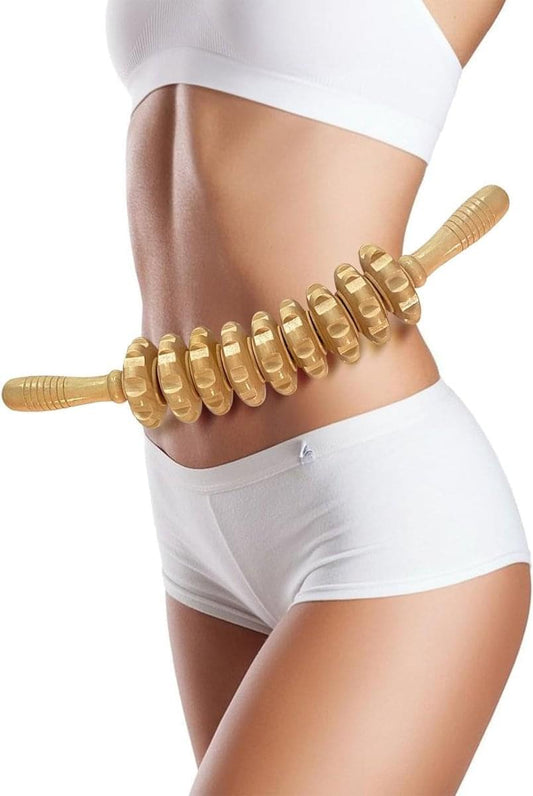 Wooden massage roller pressed along waist and hip area on legs