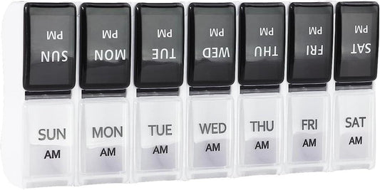 7-day pill box organizer with black hinged lids and labeled AM/PM compartments