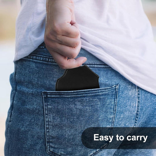 Pocket magnifying glass held in hand near jeans pocket opening