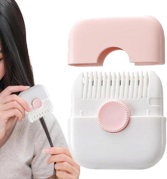 Pink and white hair trimmer comb device with removable trimming head.
