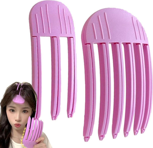 Pair of pink sectioning hair root clips with comb-like prongs