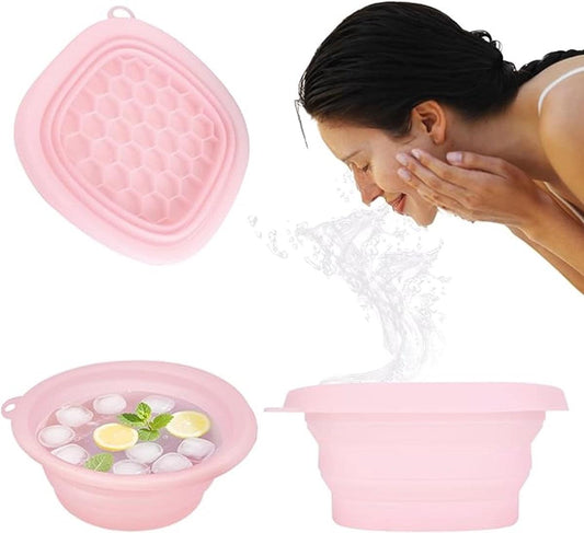 Pink silicone facial cooling basin with hex-mesh ice tray, foldable design.