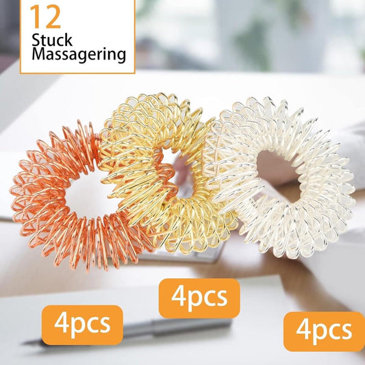 Coiled finger massage ring set: gold, white-silver, and orange circular loops