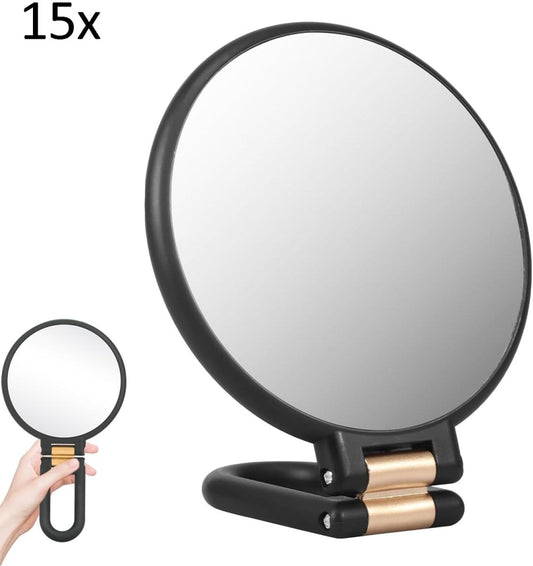 15x folding magnifying hand mirror with black round frame and hinged handle, gold accents