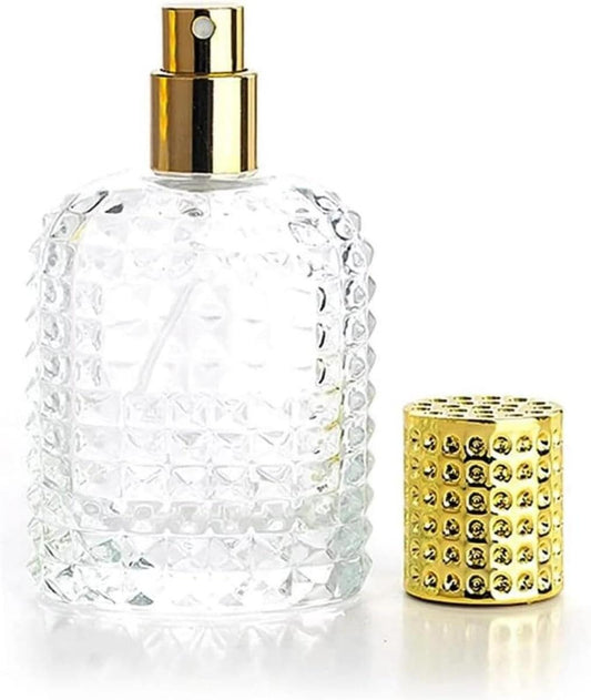 Refillable mini perfume spray bottle, clear textured glass with gold pump top