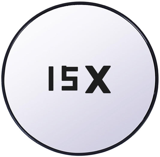 Round magnifying mirror with black rim and magnification text on glass