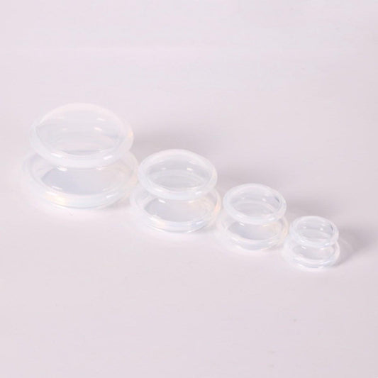 Set of transparent silicone cupping cups, four stackable cup sizes