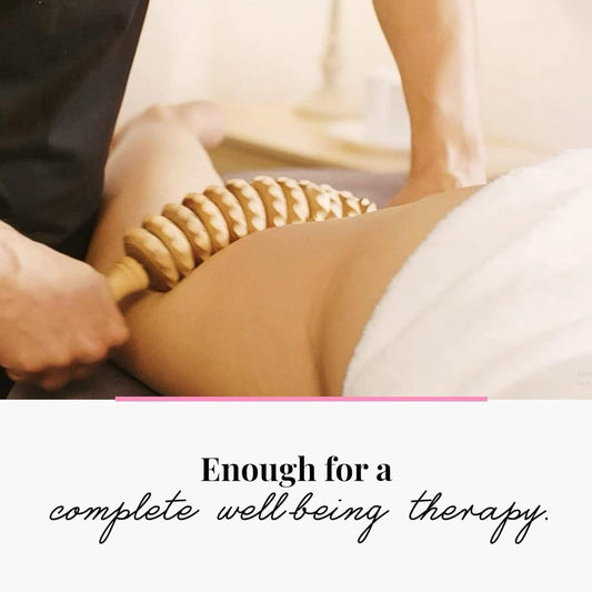 Wooden ridged massage roller used on a person's shoulder and upper back