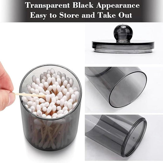 Transparent black cotton holder jar with lid, filled with white cotton swabs