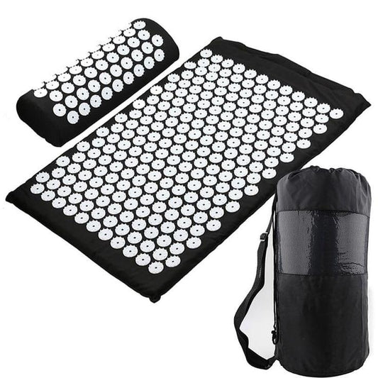 Black acupressure nail mat with white plastic tips and folded carry roll pouch