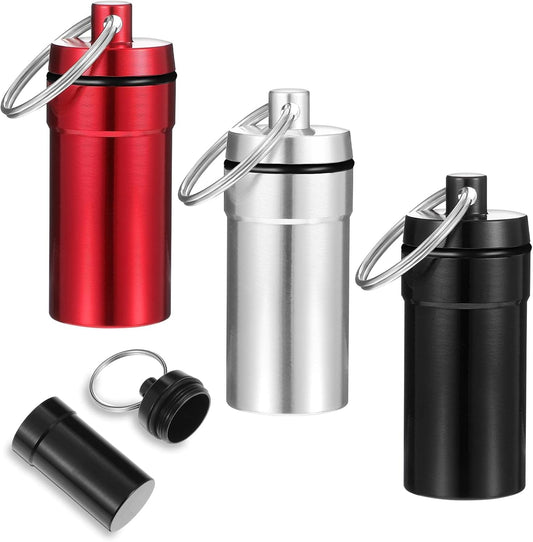 3-pack mini pill holder keychains in red, silver, and black with key rings
