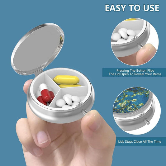 Handheld three-compartment pill box, lid open with tablets and capsules