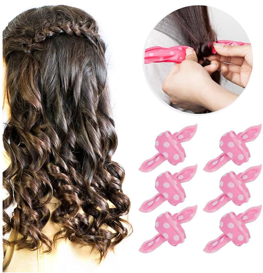 Dark brown hair with spiral curls styled using pink sponge curling rollers