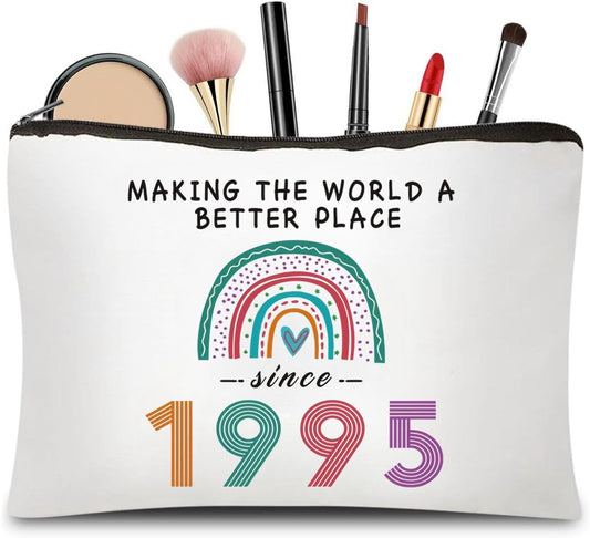 White zip makeup bag with black trim and rainbow 1995 print on the front