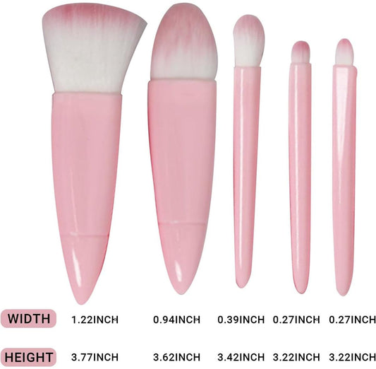 Set of five pink-handled makeup brushes with soft white bristles