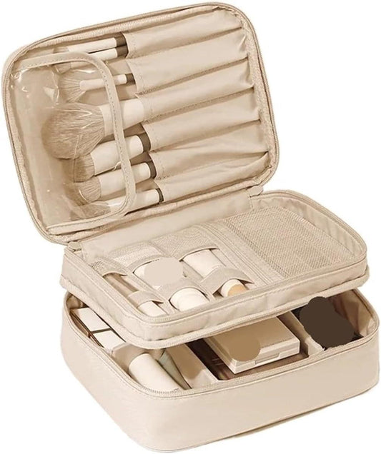 Cream makeup bag open with brush holder, clear pocket, and organized compartments