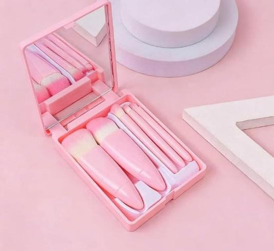Pink mini makeup brush set with mirror, five compact brushes in open case