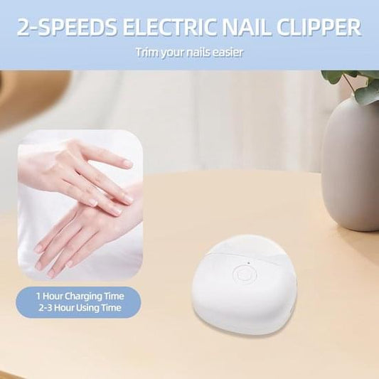 White electric nail clipper placed on a surface, circular power button visible