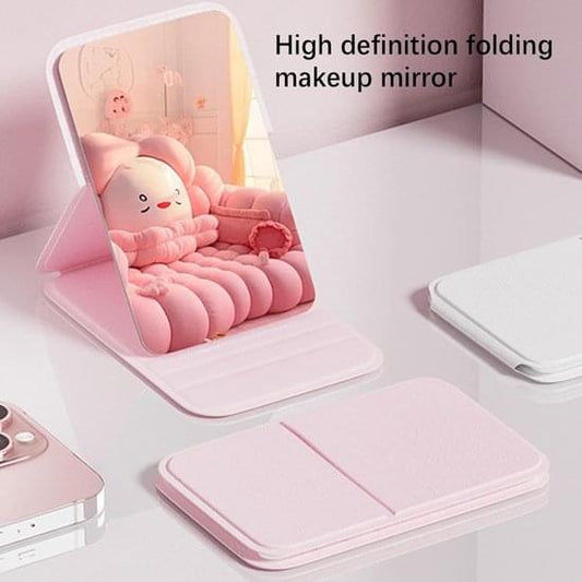 Pink folding makeup mirror with hinged stand, open mirror and closed cover shown