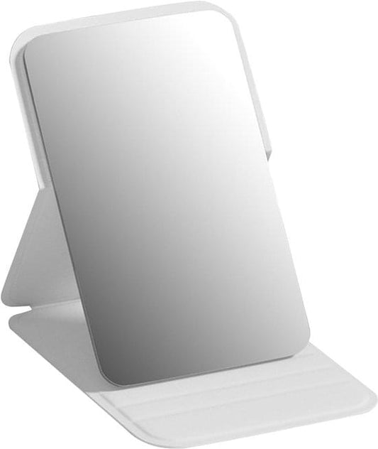 Foldable white PU leather makeup mirror with frameless reflective panel, angled for use