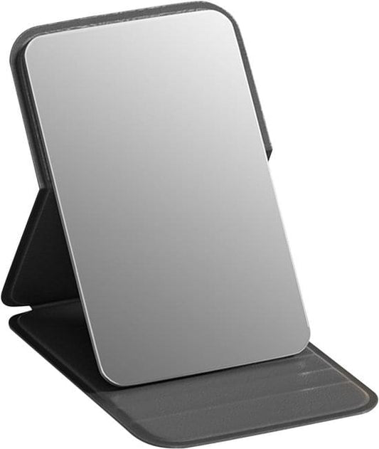 Foldable black makeup mirror with frameless glass and dark PU leather stand