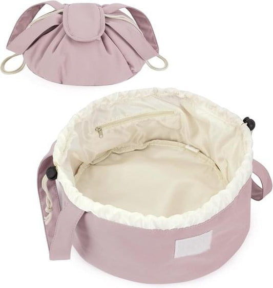 Pink foldable makeup bag with cream lining, open top and drawstring ties