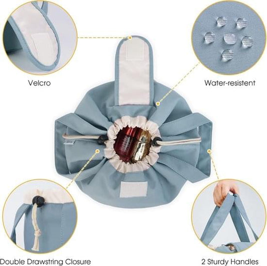 Blue fabric makeup bag with drawstring closure, two handles, and Velcro top strap