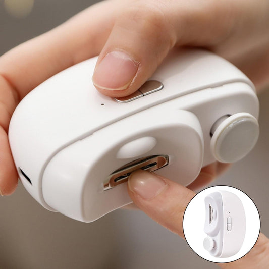 Electric toenail grinder with rotating metal grinding head on white handheld casing