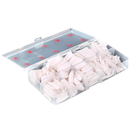 Clear and white French acrylic nail tips in open storage box