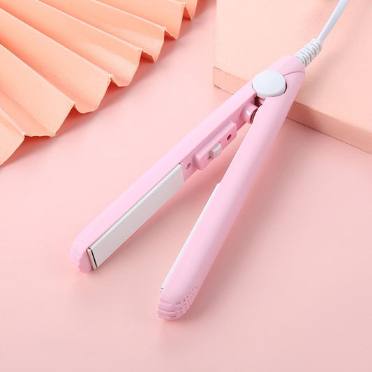 Pink mini hair curler with cord and clamp, compact straightener design