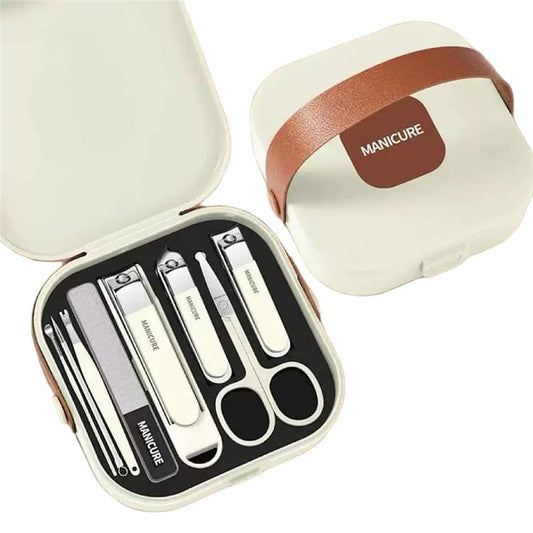 Manicure tools set in open travel case, showing nail files, clippers, and tweezers
