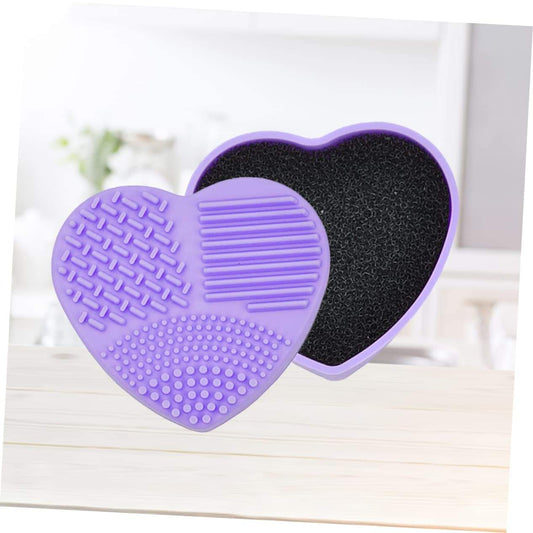 Heart-shaped makeup brush cleaner with black sponge pad in lavender silicone