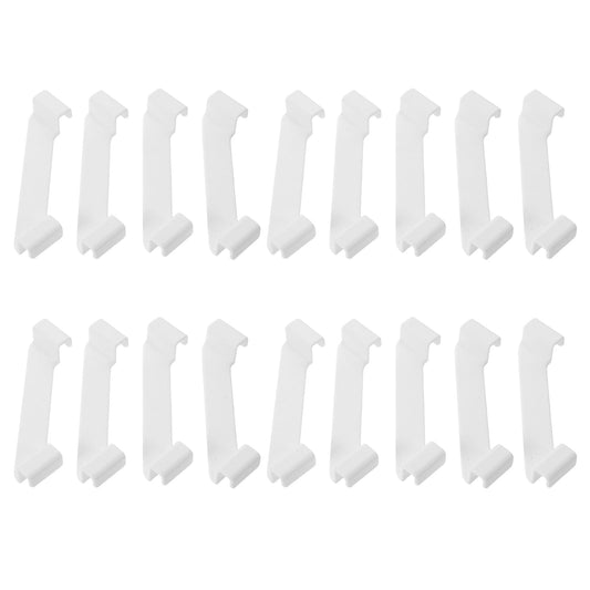 Set of white storage box connectors molded clips laid out on a white background.